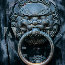 antique oriental door knocker .