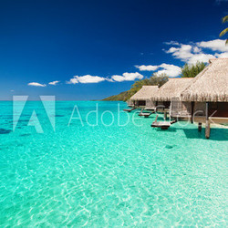 Villas on the tropical beach with steps into water