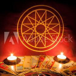 Tarot cards illuminated by candlelight.