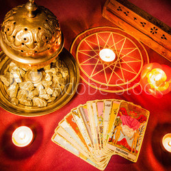 Tarot cards illuminated by candlelight.