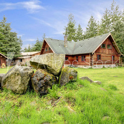 Classic old log cabin house in the country side.