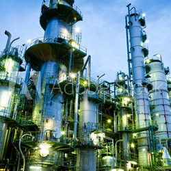 Column tower in petrochemical plant at twilight