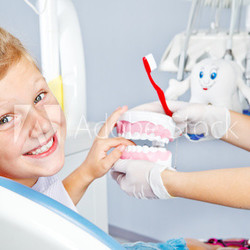 Happy child with toy dentures