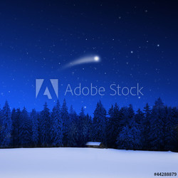 Verschneite Schihütte und Weihnachtsstern