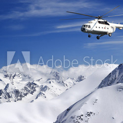 Helicopter in winter mountains
