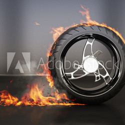 Tire burnout with flames smoke and debris