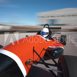 Red bolide driving at high speed in circuit.Camera on board view