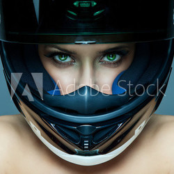 Sexy woman in helmet on blue background
