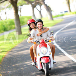 Scooter - couple driving in summer