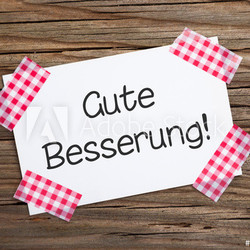 Klebestreifenzettel auf Holz GUTE BESSERUNG!