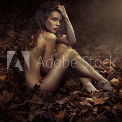Naked pretty princess among leaves