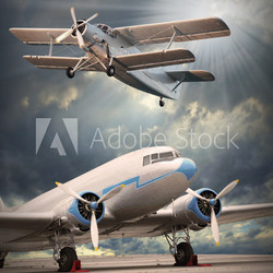 Two vintage aircraft on the runway. Retro style picture.