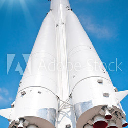 Space transport rocket against blue sky