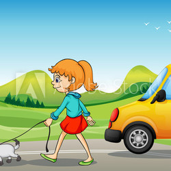 A girl with a dog walking along the street
