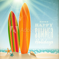 Surfboards on a beach against a sunny seascape