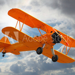 Old biplane on the sky.