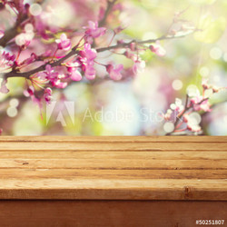 Spring blossom background with wooden deck table