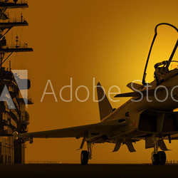 jagdjet auf flugzeugträger im sonnenuntergang