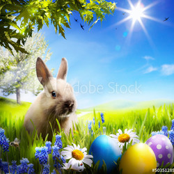 art Little Easter bunny and Easter eggs on green grass