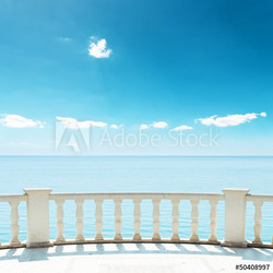 balcony near sea under deep blue sky