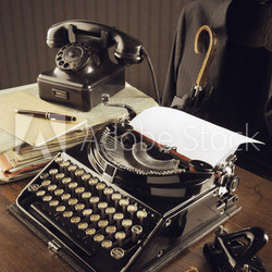 Old typewriter on a wooden desk
