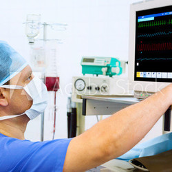 anaesthesiologist at monitor in operation room