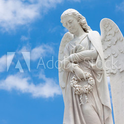 Beautiful angel with a blue sky background