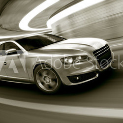 Car driving fast in tunnel