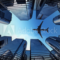 Business towers with a airplane silhouette