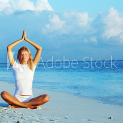 yoga woman on sea coast