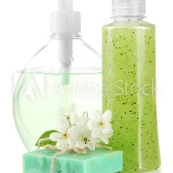 Cosmetics bottles and natural handmade soap, isolated on white