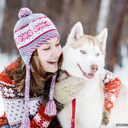 Young woman with dog winter outdoors fun