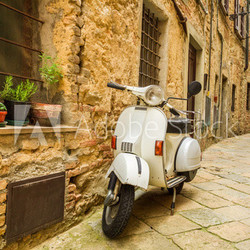 Old Vespa scooter on the street in Italy