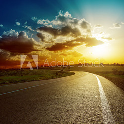 perfect sunset over asphalt road