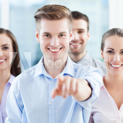 Business group pointing at you