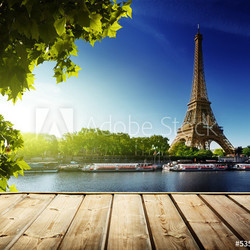 background with wooden deck table and  Eiffel tower in Paris