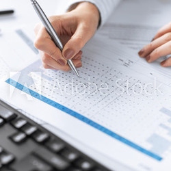 woman hand writing on paper with numbers