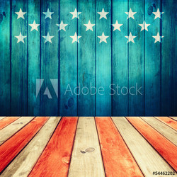 Empty wooden deck table over USA flag background