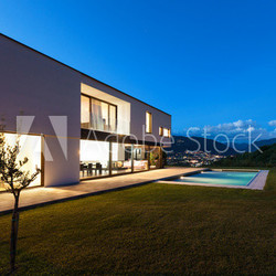 Modern villa with pool, night scene