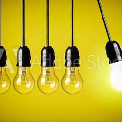 Idea concept on yellow background. Perpetual motion with light b