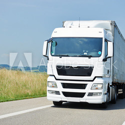 lorry moving with trailer on lane
