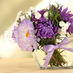 Beautiful bouquet of bright flowers in glass vase,