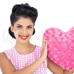 Lovely black hair model holding a pink heart shaped pillow