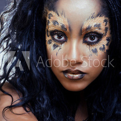 beauty afro woman with leopard make up