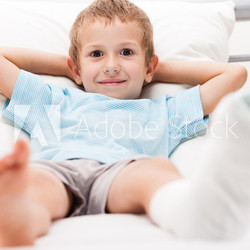 Little child boy with plaster bandage on leg heel fracture or br