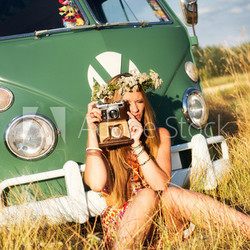 attractive woman taking pictures with an old camera