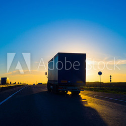 Silhouette of a truck at sunset