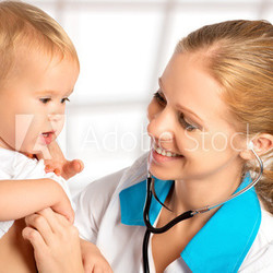 baby and doctor pediatrician. doctor listens to the heart with s