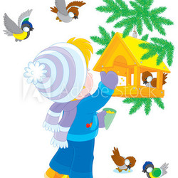 Child feeds birds in a birdfeeder