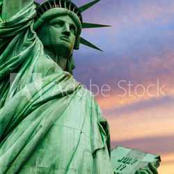 Statue of Liberty under colorful sky